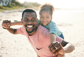 Image showing Black family, beach and a piggyback daughter with her father outdoor in nature together during summer. Portrait, smile or fun with a happy dad and girl child bonding on the sand by the ocean or sea