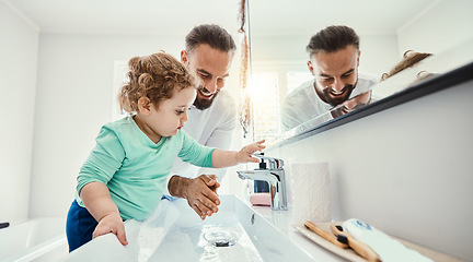 Image showing Cleaning, washing hands and father with baby in bathroom for hygiene, wellness and healthcare at home. Family, skincare and dad with child learning to wash with water, soap and disinfection by faucet