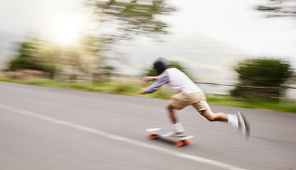 Image showing Skateboard, moving and man with motion blur for sports competition, training and exercise on street. Skating, skateboarding and male skater riding for speed, adventure and adrenaline in extreme sport