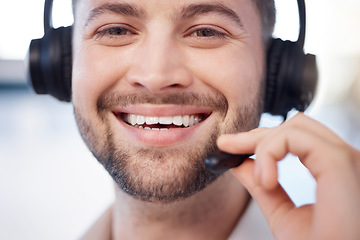 Image showing Man at call center, face and contact us with customer support employee, smile and CRM with consultant closeup. Professional, portrait and communication, male with headset, help desk and telemarketing