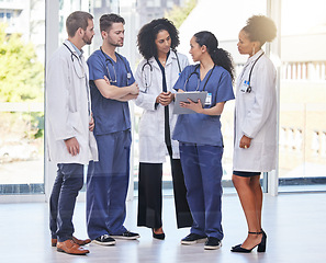 Image showing Doctors, teamwork and medical discussion in hospital for surgery planning, agenda report and schedule. Diversity group of healthcare staff in collaboration of paperwork, research and medicine results