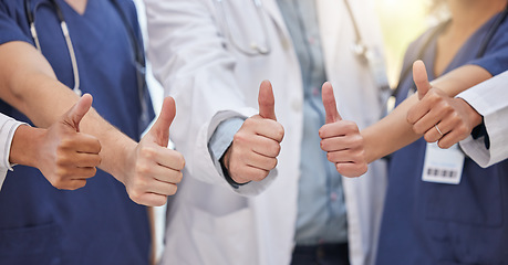 Image showing Thumbs up, group hands and teamwork of doctors celebrate success, support and trust in medical clinic. Closeup, healthcare staff and thumb sign in collaboration, agreement and yes emoji of motivation