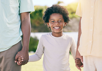 Image showing Portrait of kid, smile and holding hands of parents, happy in backyard garden and support, trust and love in adoption diversity. Family, children and biracial couple with black child in park together