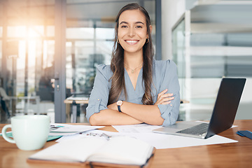 Image showing Business woman, portrait and smile at desk in office for paperwork, laptop or administration in Canada. Happy, young or confident female worker with pride planning project at table in startup company