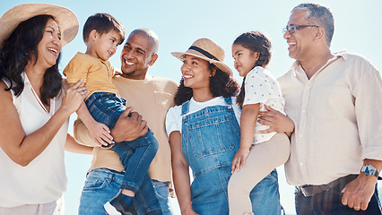 Image showing Children, beach and summer with a black family together outdoor on the sand by the ocean or sea for holiday. Kids, love or nature with siblings, parents and grandparents bonding outside on the coast