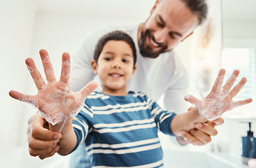 Image showing Hands, soap and father with boy in bathroom for hygiene, wellness and healthcare at home. Family, skincare and dad with child smile learn to washing palms with water, foam and disinfection by faucet