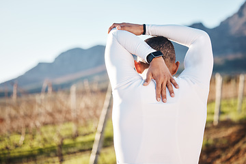 Image showing Man, stretching before running and fitness outdoor with hiking or run in countryside, exercise and warm up. Arms, muscle and strong male with back view, start with race for marathon or trekking