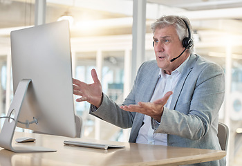 Image showing Frustrated, confused and stress in call center, man with headset and contact us, CRM problem and computer glitch. Mature male employee, tech support mistake or software error in customer service