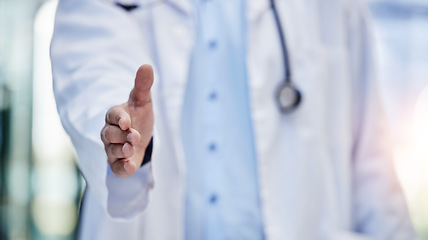 Image showing Doctor, handshake and greeting hand gesture to welcome, onboarding and partnership by medical worker in hospital. Closeup, one and person or healthcare professional offer agreement for interview