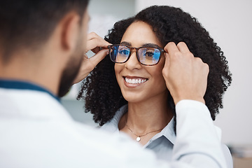 Image showing Glasses, vision and optometry with a black woman customer in an optician office for consulting. Eyewear, frame and frame with a doctor or consultant helping a female patient to correct eyesight