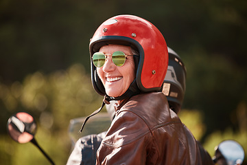 Image showing Senior woman, motorcycle road trip and smile with helmet, sunglasses and back for speed, vacation and nature. Elderly lady, happy and travel with motorbike, freedom and fast transportation in summer