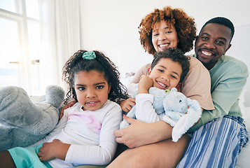 Image showing Big family, portrait and bedroom with a mom, dad and children together in morning. Group hug, happiness and smile in a house with parent love, support and bonding with kids, mom and father at home