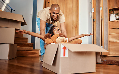 Image showing New home, father and pushing girl in box, having fun and bonding after moving in house. Real estate, family property and child with teddy bear, boxes and happy dad playing to celebrate relocation.