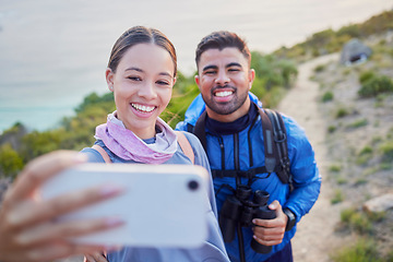 Image showing Man, woman and hiking selfie with smile, love and happiness in nature for outdoor adventure on holiday. Young happy couple, blog and mountain for care, bonding and vacation with social media app