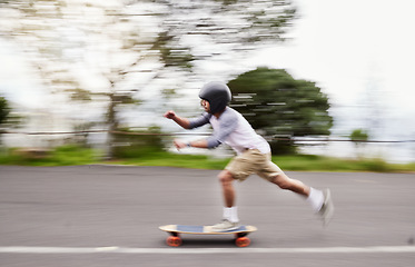 Image showing Skateboard, motion blur and man speed on road for sports competition, training and exercise in city. Skating, skateboarding and male skater ride for adrenaline, adventure and freedom for challenge