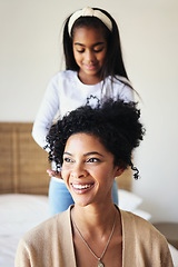 Image showing Daughter or child brushing mother hair and bonding in a home bedroom smile, adorable and happy together. Single mom, kid and mum relax spending quality time grooming in a house in happiness