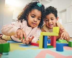 Image showing Building blocks, happy children and floor with toys for playing, bonding and educational games at home. Family, child development and boy and girl enjoy creative activity, learning and relaxing