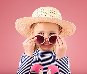Image showing Vacation, portrait of child in studio with sunglasses and fun clothes and hat isolated on pink background. Summer, holiday and fashion, happy girl in Australia excited for travel with smile on face.