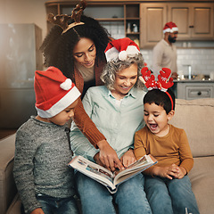 Image showing Happy, christmas and family looking at a photo album for memories, nostalgia and bonding. Smile, festive and mother, grandmother and children excited to look at pictures of relatives in a book