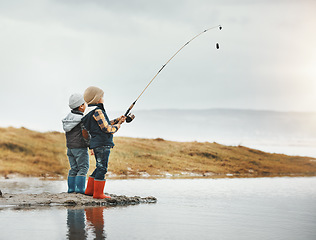 Image showing Lake, activity and children fishing while on vacation, adventure or weekend trip for a hobby. Outdoor, nature and boy siblings or kids catching fish in water together while on holiday in countryside.