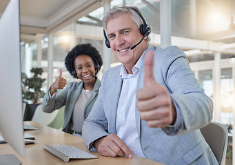 Image showing Customer support, thumbs up and portrait of call center employees happy at computer in consulting office. Help desk, smile and mature man with black woman at advisory agency for crm networking online