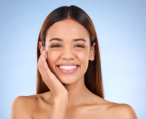 Image showing Portrait, skincare and woman with smile, beauty and dermatology against blue studio background. Face detox, female and lady with happiness, grooming and morning routine for smooth, glow and soft skin