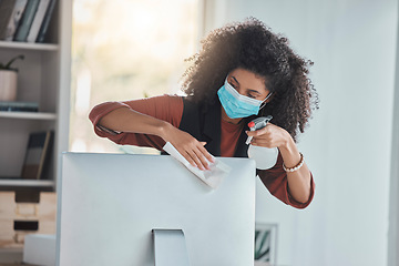 Image showing Covid, business and a black woman cleaning her computer in the office for health, safety or control. Compliance, bacteria and regulations with a female employee wiping her desktop pc for disinfection