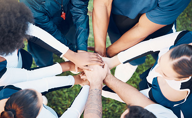 Image showing Above, hands and friends in sports huddle for support, collaboration or team building mission. Top view, people and hand connect for teamwork, motivation and cooperation, agreement and training goal