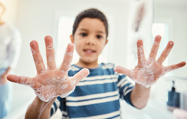 Image showing Cleaning, hands with soap and boy in bathroom for hygiene, wellness and healthcare at home. Healthy family, skincare and portrait of child with open palms washing with water, soap and disinfection