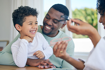 Image showing Happy child, glasses choice and father in a doctor office for vision and eye exam with pediatrician. Happiness, dad and young boy together at a clinic looking and lens and frames after a eyes test