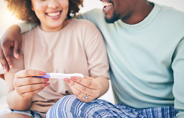 Image showing Happy, couple and pregnancy test, smile and excited for good news, positive and results in their house. Hands, woman and man with home testing kit, pregnant and fertility or ivf success while hugging