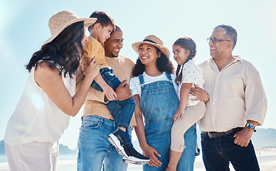 Image showing Kids, beach and summer with a black family together outdoor on the sand by the ocean or sea for holiday. Children, love or nature with siblings, parents and grandparents bonding outside on the coast