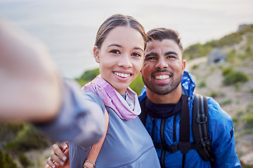 Image showing Man, woman and hiking selfie portrait with love, happiness and nature for outdoor adventure on holiday. Young happy couple, blog and mountain for care, bonding and vacation with social network