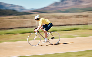 Image showing Man cycling with blurred background speed in nature, countryside and training for triathlon, sports and power. Cyclist, bicycle and motion of bike for fitness, energy and exercise performance on path