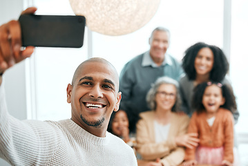 Image showing Group, happy and a man with family for a selfie, memory and photo together. Smile, bonding and a guy taking a picture on a phone with parents and children for quality time during a home visit