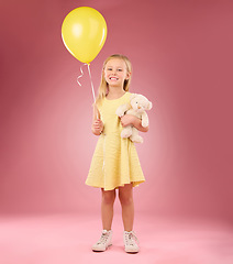 Image showing Teddy bear, girl balloon and portrait with a soft toy with happiness and love for celebration in studio. Isolated, pink background and a young female feeling happy, joy and cheerful with friend