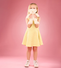 Image showing Teddy, girl and portrait with a kids soft toy with happiness and love for toys in a studio. Isolated, pink background and a young female child feeling happy, joy and cheerful with bear friend