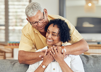 Image showing Love, relax and senior couple hug, care and enjoy quality bonding time on home living room sofa. Retirement happiness, marriage smile and romantic elderly husband, wife or people happy together