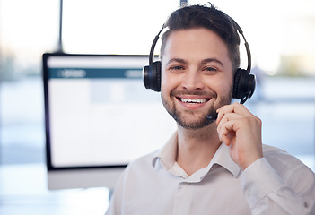 Image showing Man at call center, face and contact us with customer service employee, smile and CRM with consultant. Professional, portrait and communication, male with headset with help desk and telemarketing