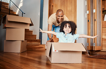 Image showing Box, fun and child with father in living room celebrating moving day, rental or real estate. Property, home and boy with parent, cardboard or airplane game while packing for relocating or new house