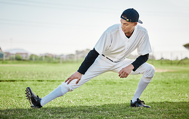 Image showing Baseball stadium, stretching or sports athlete on field ready for training match on grass in summer. Active man, fitness workout or young player in legs warm up to start softball exercise outdoors