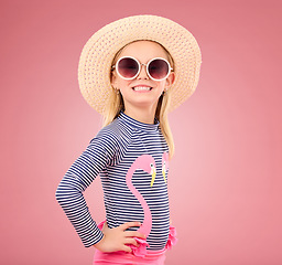 Image showing Vacation, portrait of child with sunglasses and hat in studio with fun clothes isolated on pink background. Summer, holiday and fashion, happy girl in Australia excited for travel with smile on face.