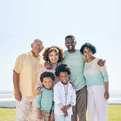 Image showing Smile, love and portrait of a happy family at a beach for travel, vacation and holiday on nature in summer. Relax, face and trip with children, parents and grandparents bond while traveling in Miami