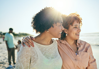 Image showing Love, beach and mother with her adult daughter walking by the ocean together while on vacation. Happy, smile and mature woman bonding with her female child by the sea while on holiday or weekend trip