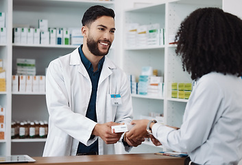 Image showing Man, pharmacist and medication consulting customer at counter for prescription drugs or medicine at the clinic. Male doctor giving patient medical antibiotics at the pharmacy for healthcare wellness