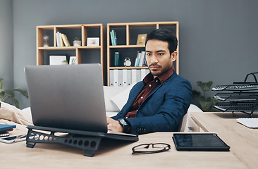 Image showing Business, man and laptop for digital planning, thinking or typing for ideas, data analytics or search internet. Male employee, entrepreneur or manager with device, concentration or research in office