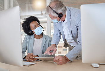 Image showing Covid, black woman and man with tablet at call center with mask coaching and helping at help desk. Compliance, consulting and opinion, crm data for medical advisory agency with diversity and support.