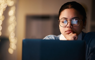 Image showing Woman, thinking or reading laptop in night office for growth planning, finance investment or risk management solution. Serious, concentration or working late student on technology with mock up ideas