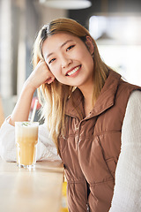 Image showing Happy, cafe and portrait of a woman with a drink in the morning for breakfast at a coffee shop. Smile, happiness and beautiful Asian girl with a beverage at a restaurant for enjoyment and relaxation