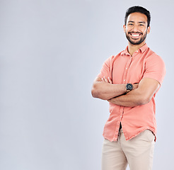 Image showing Portrait, mockup and a man in studio, crossed arms standing on a gray background for branding or product placement. Marketing, advertising and mock up with a young male posing for fashion or style